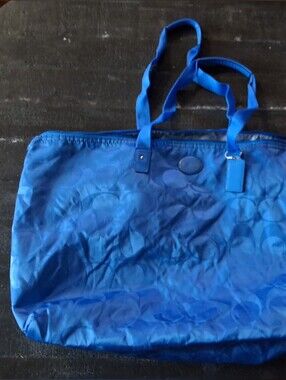 vibrant blue Coach Getaway Signature Nylon Packable Weekender Bag